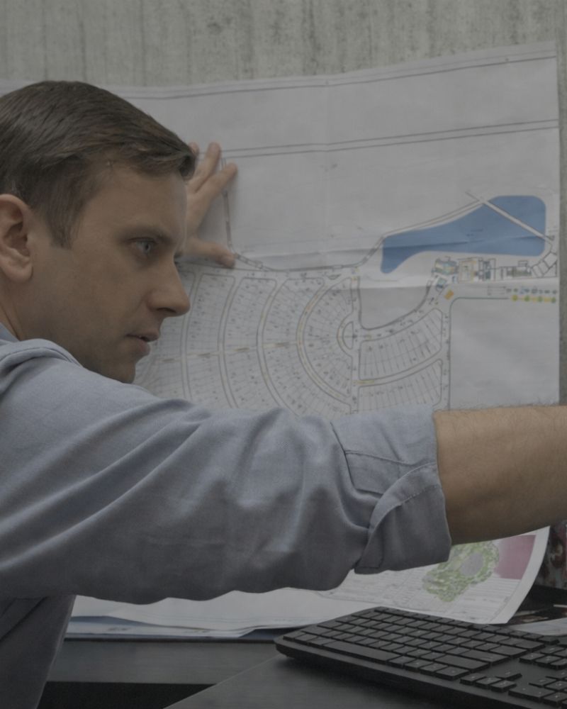 Professional investor looking at architectural model